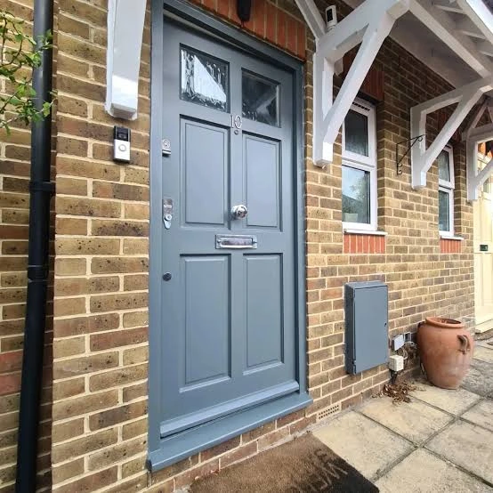 Freshly spray painted anthracite grey garage door