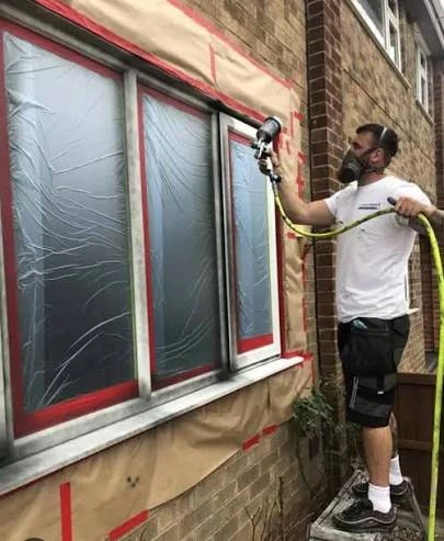 Window frame sections covered during spraying