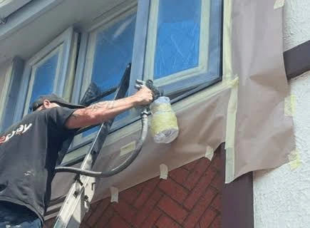 Sprayed Tech Solution team completing a uPVC window spraying project